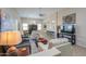 Cozy living room with ample seating, tile flooring, and open layout at 60 S Agua Fria Ln, Casa Grande, AZ 85194