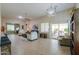 Spacious living room with tile floors, neutral colors, and lots of natural light at 60 S Agua Fria Ln, Casa Grande, AZ 85194