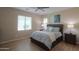Inviting main bedroom featuring large windows and a comfortable bed at 60 S Agua Fria Ln, Casa Grande, AZ 85194