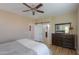 Main bedroom with dresser, open closet access, and connecting bathroom at 60 S Agua Fria Ln, Casa Grande, AZ 85194