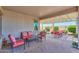 Inviting covered patio with comfortable seating, perfect for outdoor relaxation and entertaining at 60 S Agua Fria Ln, Casa Grande, AZ 85194