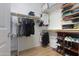 Organized walk-in closet with shelving, hanging racks, and space for shoes and accessories at 60 S Agua Fria Ln, Casa Grande, AZ 85194
