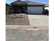 Modern single-Gathering home with a two-car garage and minimal landscaping for a clean, contemporary look at 6050 E Artemis Dr, Florence, AZ 85132