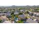 Expansive aerial view of the neighborhood, showcasing homes and community pool at 6961 W Honeysuckle Dr, Peoria, AZ 85383