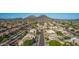 Beautiful neighborhood with tree-lined streets, mountain views, and well-manicured lawns at 6961 W Honeysuckle Dr, Peoria, AZ 85383