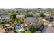 Aerial view of the house highlighting the large solar panel system and private swimming pool at 6961 W Honeysuckle Dr, Peoria, AZ 85383