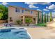 Well-maintained backyard with a covered patio, pool, and mature landscaping for outdoor enjoyment at 6961 W Honeysuckle Dr, Peoria, AZ 85383