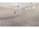 Empty bedroom featuring neutral carpet, neutral paint, and a ceiling fan at 6961 W Honeysuckle Dr, Peoria, AZ 85383