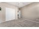 Bright bedroom featuring a double closet with carpeting at 6961 W Honeysuckle Dr, Peoria, AZ 85383