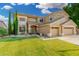 Beautiful two-story home showcasing a well-maintained lawn, desert landscape, and wide driveway at 6961 W Honeysuckle Dr, Peoria, AZ 85383