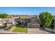 Beautiful two-story home featuring a well-manicured lawn and a three-car garage at 6961 W Honeysuckle Dr, Peoria, AZ 85383
