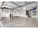 Clean, empty garage with epoxy floor and plenty of storage space at 6961 W Honeysuckle Dr, Peoria, AZ 85383
