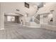 Expansive living room with a staircase, tall ceilings, neutral paint, and a dining room view at 6961 W Honeysuckle Dr, Peoria, AZ 85383