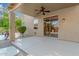 Comfortable covered patio with ceiling fan and seamless access to indoor-outdoor living at 6961 W Honeysuckle Dr, Peoria, AZ 85383