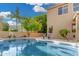 Sparkling pool surrounded by mature trees and landscaping, creating a private backyard oasis at 6961 W Honeysuckle Dr, Peoria, AZ 85383