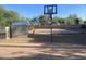 Backyard featuring a basketball court, storage shed, and fence providing privacy at 7044 E Ann Way, Scottsdale, AZ 85254