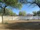Desert landscaping surrounding the backyard is highlighted by a high privacy fence at 7044 E Ann Way, Scottsdale, AZ 85254