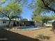 A delightful backyard pool surrounded by lush greenery, creating a private retreat at 7044 E Ann Way, Scottsdale, AZ 85254