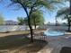 Seating near an inviting backyard pool provides relaxation and outdoor enjoyment at 7044 E Ann Way, Scottsdale, AZ 85254