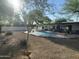 An inviting backyard pool is surrounded by desert landscaping and a nice patio at 7044 E Ann Way, Scottsdale, AZ 85254