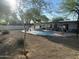 An inviting backyard pool is surrounded by desert landscaping and a nice patio at 7044 E Ann Way, Scottsdale, AZ 85254