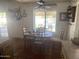 Bright dining area with a view of the pool and outdoor seating at 7044 E Ann Way, Scottsdale, AZ 85254
