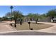 Southwestern home featuring desert landscaping and mature trees at 7044 E Ann Way, Scottsdale, AZ 85254