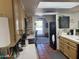 Well-lit kitchen featuring modern appliances, tiled floors and archway to the dining area at 7044 E Ann Way, Scottsdale, AZ 85254