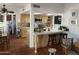 Traditional kitchen featuring a breakfast bar, terracotta tile floors, skylight, and built-in appliances at 7044 E Ann Way, Scottsdale, AZ 85254