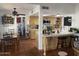 Traditional kitchen featuring a breakfast bar, terracotta tile floors, skylight, and built-in appliances at 7044 E Ann Way, Scottsdale, AZ 85254
