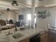 View of the living room with a fireplace from kitchen, creating a seamless flow between spaces at 7044 E Ann Way, Scottsdale, AZ 85254
