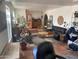 Spacious living room featuring an open floor plan, plants, and tile flooring at 7044 E Ann Way, Scottsdale, AZ 85254