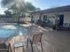Back yard features a sparkling pool with fountains, outdoor lounge, and covered patio at 7044 E Ann Way, Scottsdale, AZ 85254
