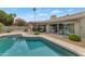 Large backyard pool with poolside patio and lounge seating that offers a private outdoor entertainment area at 7806 E Via De La Entrada --, Scottsdale, AZ 85258
