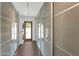 Bright hallway featuring custom storage cabinets and doors with glass inserts at 7806 E Via De La Entrada --, Scottsdale, AZ 85258
