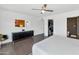 Spacious bedroom featuring ceiling fan, access to walk-in closet, and en suite bath at 7806 E Via De La Entrada --, Scottsdale, AZ 85258