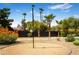Recreational backyard features a sand court and lush landscaping, offering a perfect blend of relaxation and entertainment at 8001 E Voltaire Ave, Scottsdale, AZ 85260