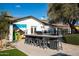 Backyard showing the outdoor bar and BBQ area with a painting that adds vibrant artistry at 8001 E Voltaire Ave, Scottsdale, AZ 85260