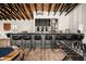 Entertainers bar area features modern seating, sleek countertops, and ample storage at 8001 E Voltaire Ave, Scottsdale, AZ 85260