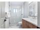 Sleek bathroom with walk-in shower, white vanity, and modern fixtures offers a clean, contemporary feel at 8001 E Voltaire Ave, Scottsdale, AZ 85260