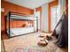 ' bedroom features a bunk bed, colorful rug, and unique decor for a playful atmosphere at 8001 E Voltaire Ave, Scottsdale, AZ 85260