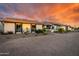 Inviting single-story home with brick driveway and desert plants in a picturesque sunset setting at 8001 E Voltaire Ave, Scottsdale, AZ 85260
