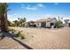 Charming single-story home with a spacious brick driveway and desert landscaping at 8001 E Voltaire Ave, Scottsdale, AZ 85260