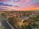 Sunset aerial view of a neighborhood with lush landscaping, swimming pools, and beautiful single-Gathering homes at 824 W Whitten St, Chandler, AZ 85225