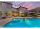 Spacious backyard featuring a pool, outdoor kitchen, and covered patio at 824 W Whitten St, Chandler, AZ 85225