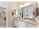 Bathroom features dual sinks, granite counters, and framed mirrors at 824 W Whitten St, Chandler, AZ 85225
