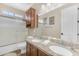 Bathroom features double sinks, a vanity, granite countertops, and bright lighting at 824 W Whitten St, Chandler, AZ 85225