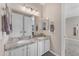 Bathroom with double sinks, granite countertops, and updated fixtures at 824 W Whitten St, Chandler, AZ 85225