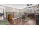 Upstairs dining area featuring wood floors, a ceiling fan, and a serving bar at 824 W Whitten St, Chandler, AZ 85225
