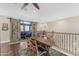 Bright dining area with wood floors, a ceiling fan, and easy access to the balcony at 824 W Whitten St, Chandler, AZ 85225